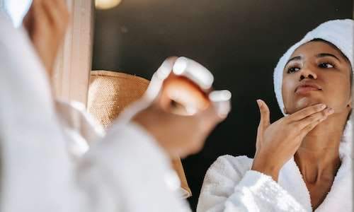 woman looking in mirror